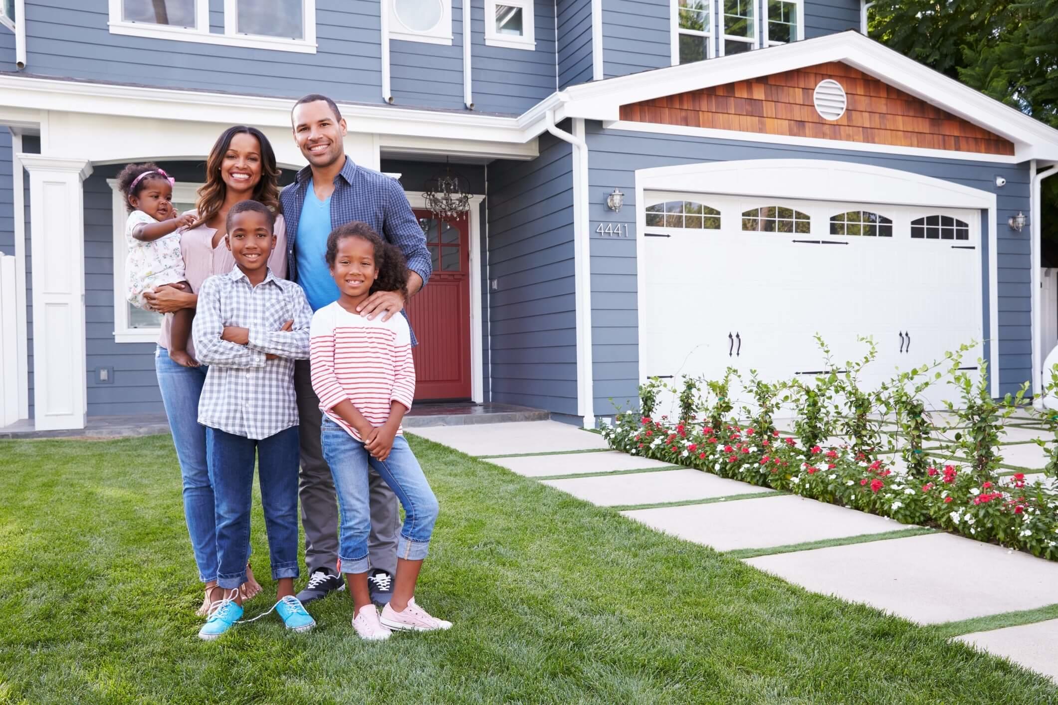 Family in Front of Home